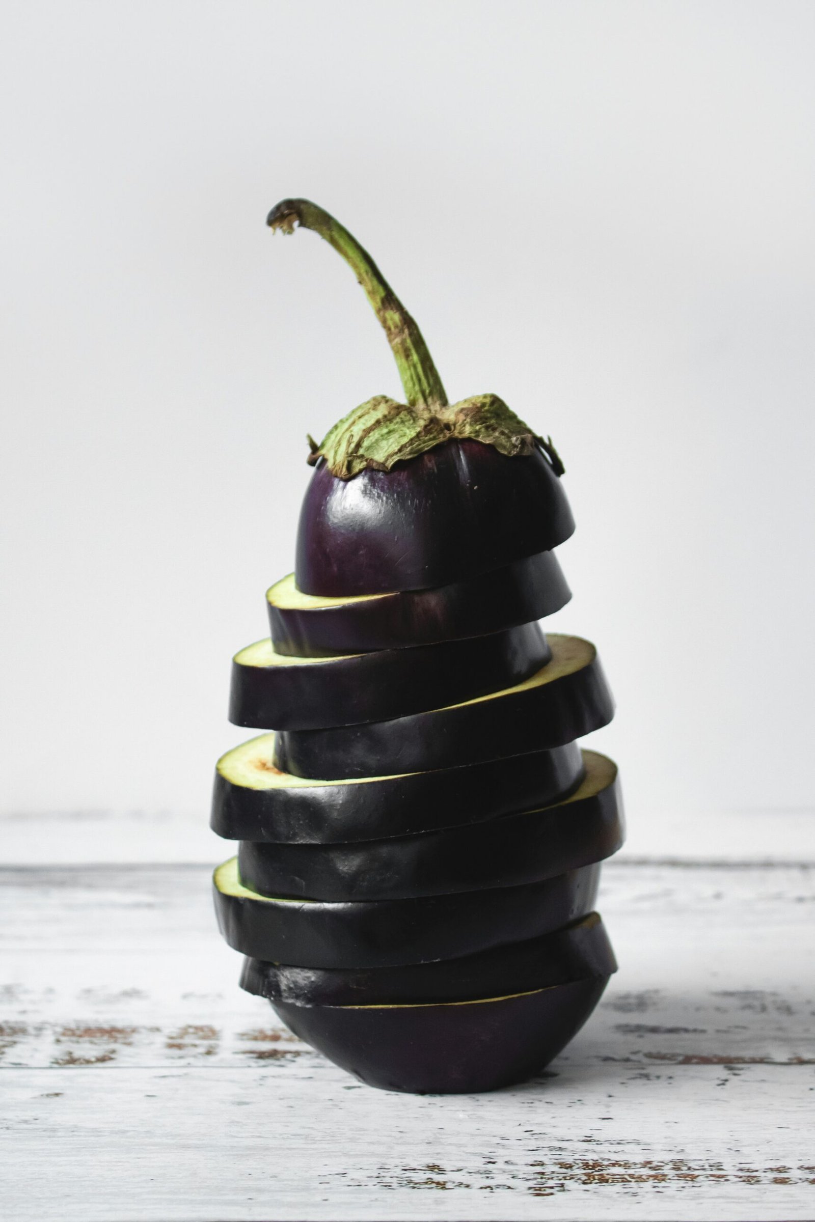 green bell pepper on black and white stripe textile