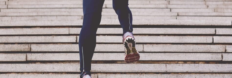 person climbing concrete stairs